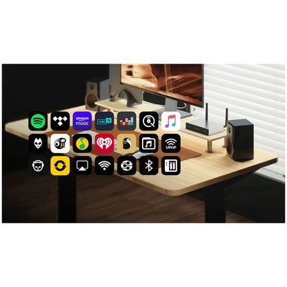 Modern office setup with a desk, computer monitor, and various icons on the screen.