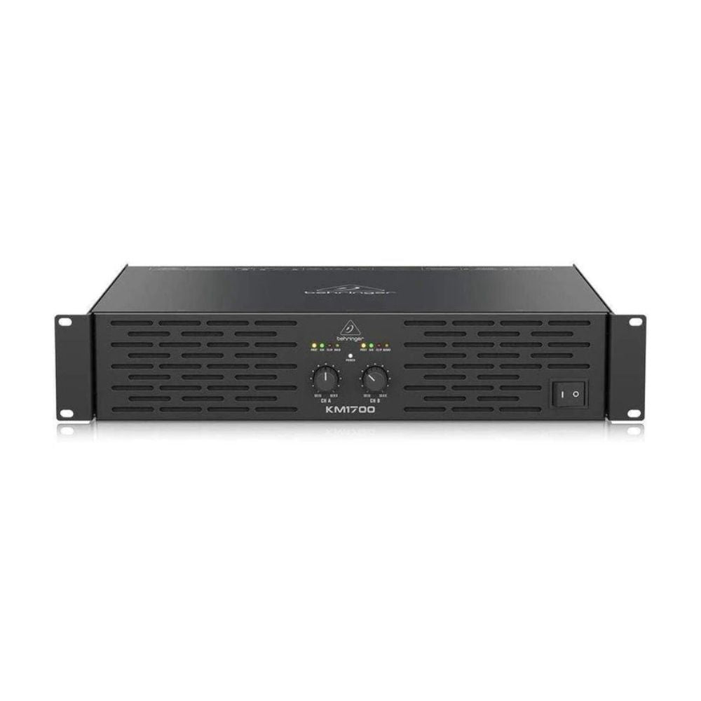 Black audio amplifier with 'Behringer' branding on a white background